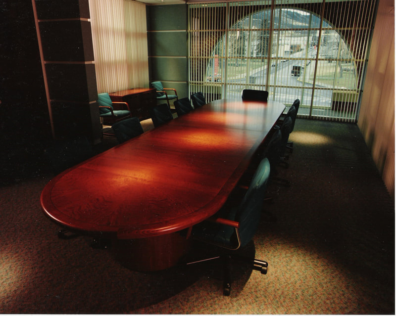 Custom office furniture, conference tables, reception areas